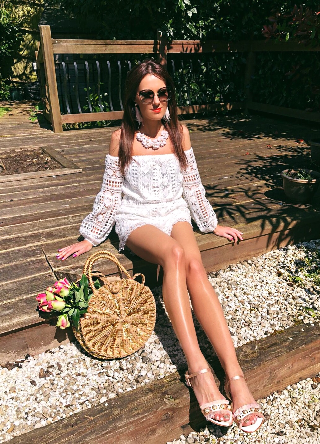 South Beach Round Gold Woven Straw Cross Body Bag | Miu Miu sunglasses | Elegant Duchess Boutique feather earrings | Glamorous Pearl Embellished Satin Sandals | Parisian Off Shoulder Crochet Playsuit | Accessorize statement necklace