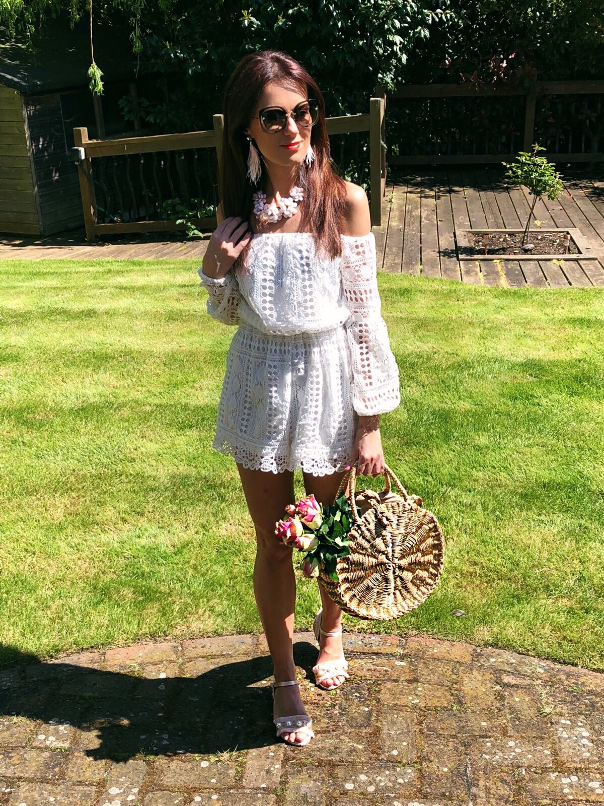 South Beach Round Gold Woven Straw Cross Body Bag | Miu Miu sunglasses | Elegant Duchess Boutique feather earrings | Glamorous Pearl Embellished Satin Sandals | Parisian Off Shoulder Crochet Playsuit | Accessorize statement necklace