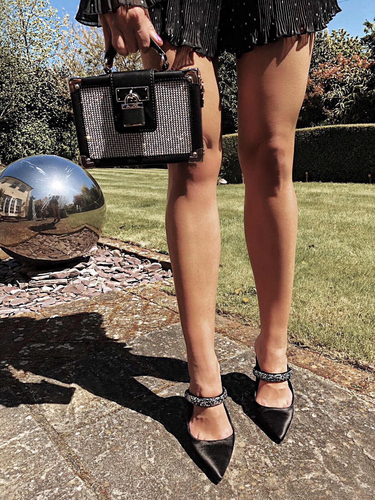 Elegant Duchess Fashion and Lifestyle ALDO Box Bag with Crystal Stud Detail | KURT GEIGER LONDON Lexington Jewelled Mule Heels | Forever Unique Black And White Polka Dot Playsuit | Miu Miu sunglasses | Swarovki crystal earrings