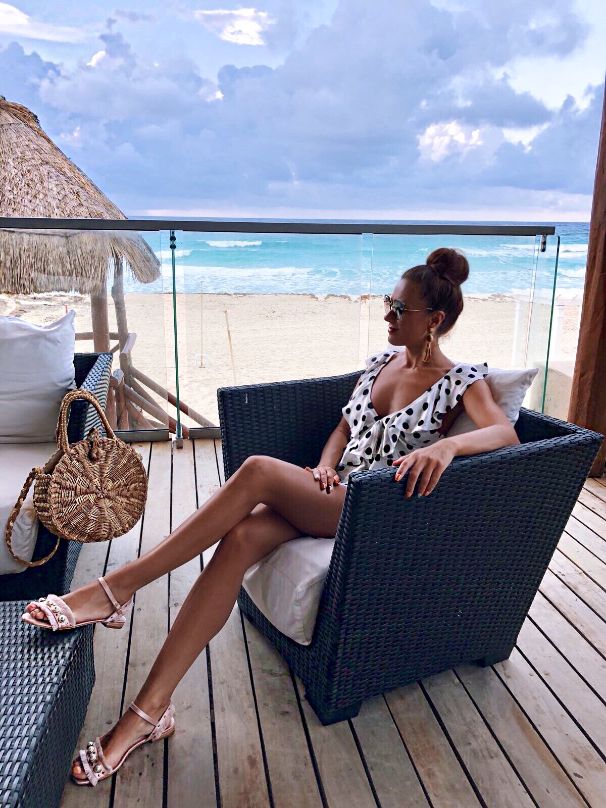 Elegant Duchess Fashion ASOS DESIGN Cut Out Ruffle Playsuit In Spot | Miu Miu sunglasses | South Beach Round Gold Woven Straw Cross Body Bag | Glamourous Pearl Sandals | ASOS DESIGN Wrapped Bead & Tassel Earrings