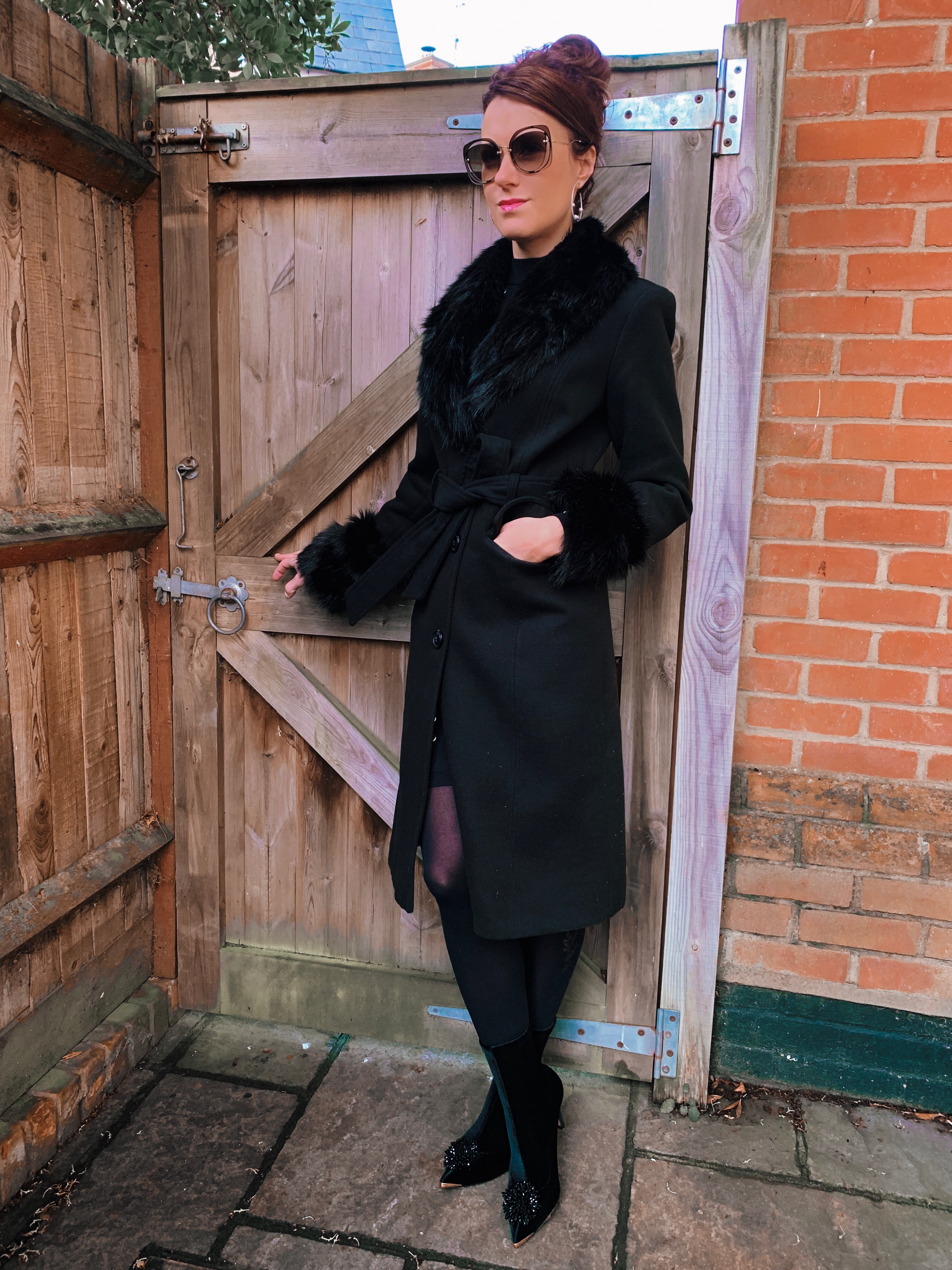 Warhouse Faux Fur Detail Belted Coat | V by Very Peplum Hem Eyelet Detail Knitted Dress | TED BAKER Elzbetv pom pom sock boots | Swarovski earrings | Miu Miu Sunglasses