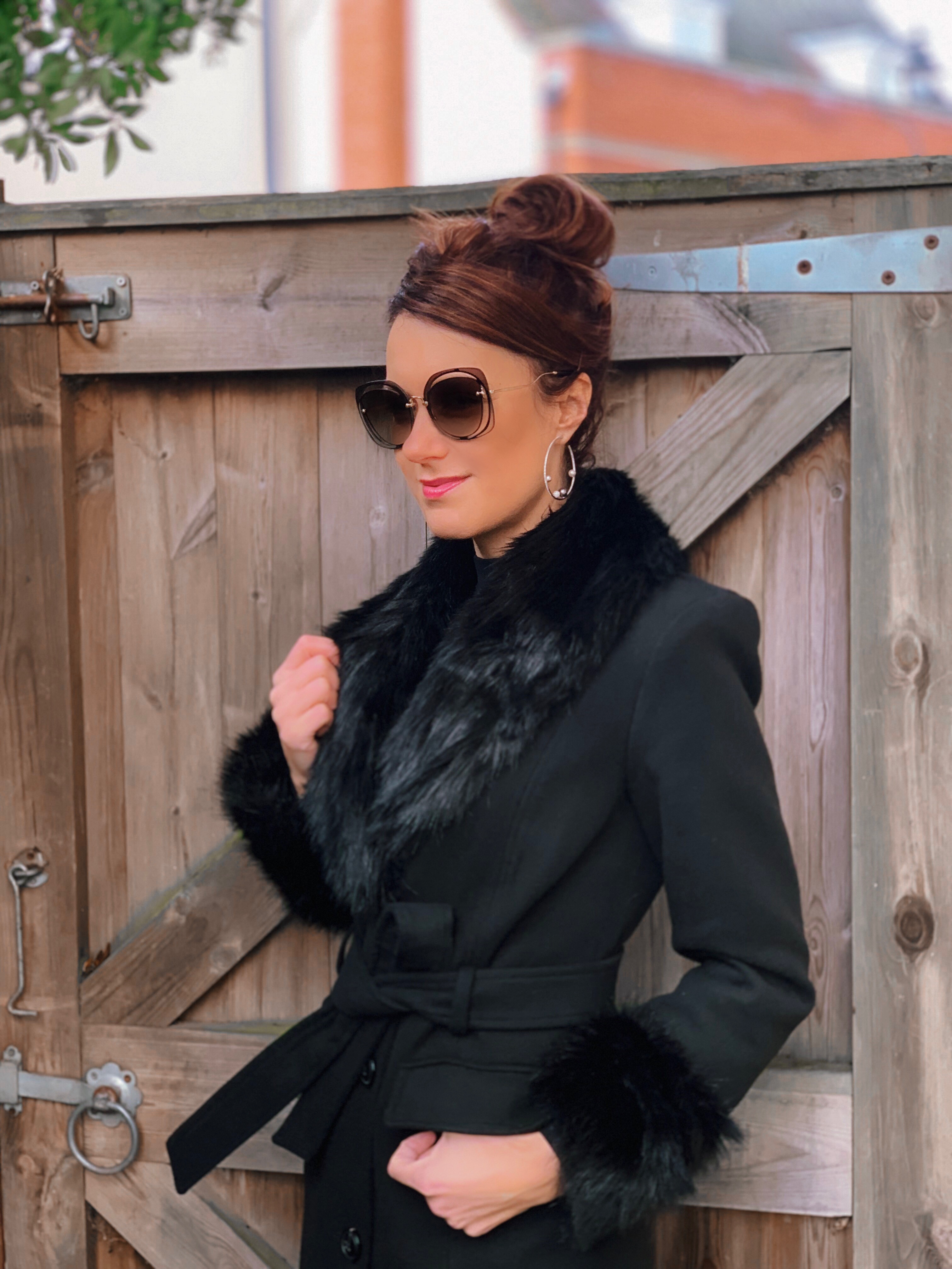 Warhouse Faux Fur Detail Belted Coat | V by Very Peplum Hem Eyelet Detail Knitted Dress | TED BAKER Elzbetv pom pom sock boots | Swarovski earrings | Miu Miu Sunglasses