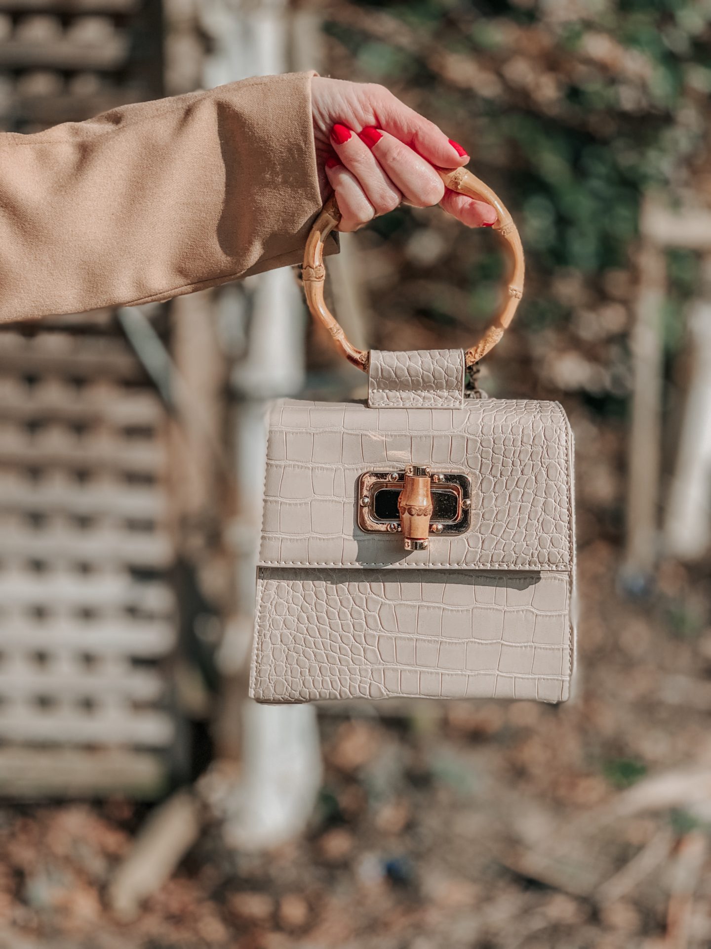 ASOS DESIGN batwing shell button pencil dress | Liars & Lovers cream mock croc bamboo handle cross body bag | Carvela Pointed Asymmetric Strap Heels | MIU MIU Scenique cut-out eyewear | Zara TEXTURED GEOMETRIC EARRINGS | Elegant Duchess Boutique Brooch